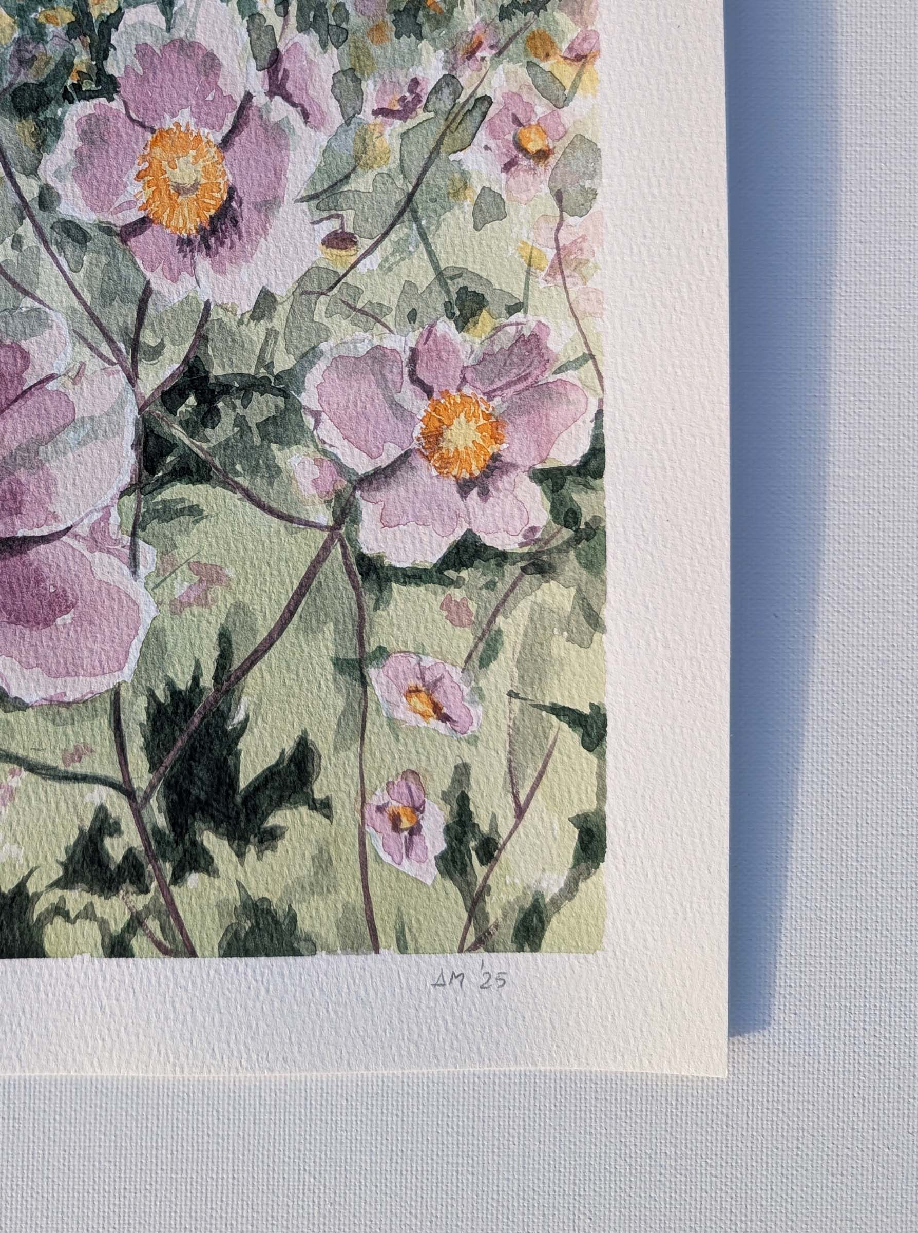 Close-up of signature on the watercolour painting of soft pink flowers with yellow centres against green foliage, by Daniela Militaru
