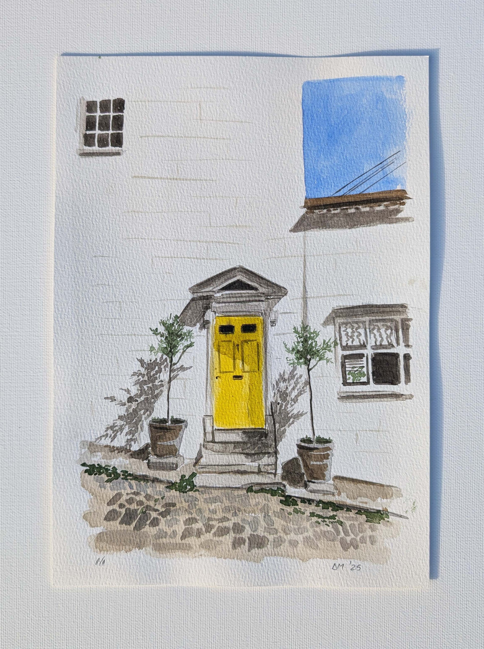 Watercolour painting of a yellow front door on a white townhouse in Arundel, by Daniela Militaru